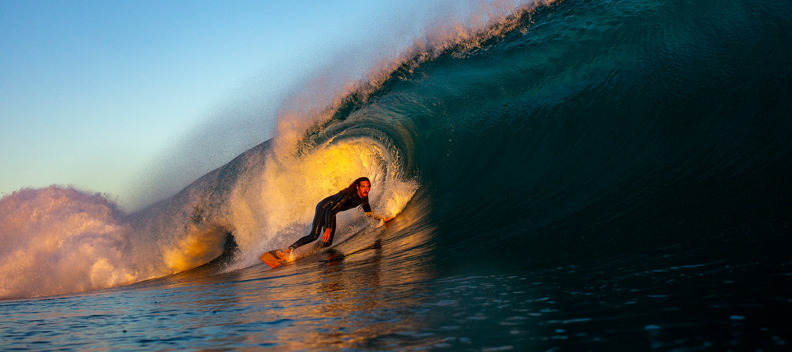 Robert Machado surfing on a huge wave