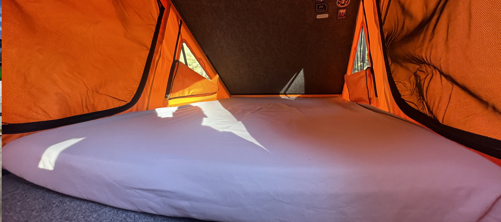 Image shows a HEST Dually Long Memory Foam Mattress inside a Go Fast Camper Standard Platform.