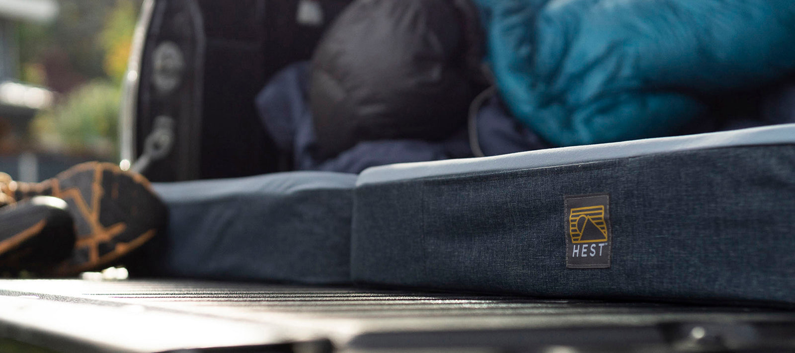 GMC Sierra truck bed camping with a dually camping sleeping pad in the truck bed